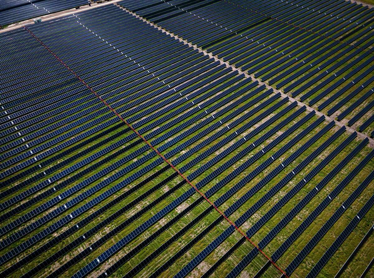 Solar panels fill fields at a large solar farm south of El Campo.