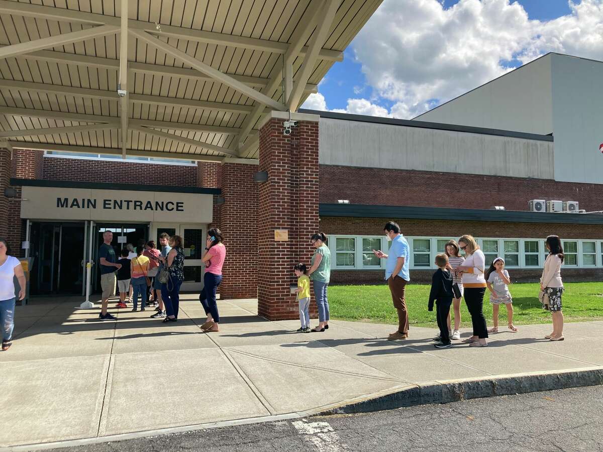 Voters waited in a line that stretched down the hallway at Bethlehem High School, out the door, and to the parking lot. The line was so long that staffers were sent outside to direct people to chairs inside who could not stand for long.