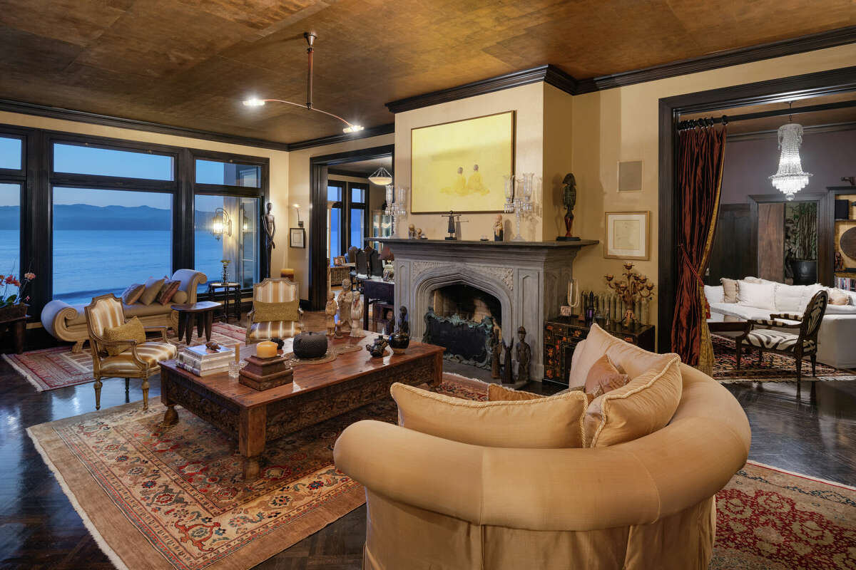 In the main level living area, a huge fireplace offsets the coolness of the ocean view.   