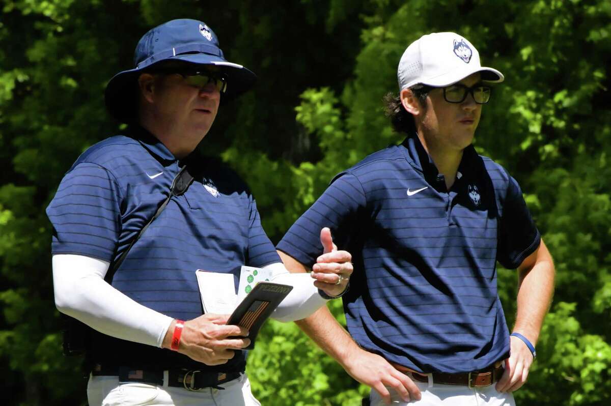 UConn golf coach Dave Pezzino with Caleb Manuel from a golf match earlier this season.
