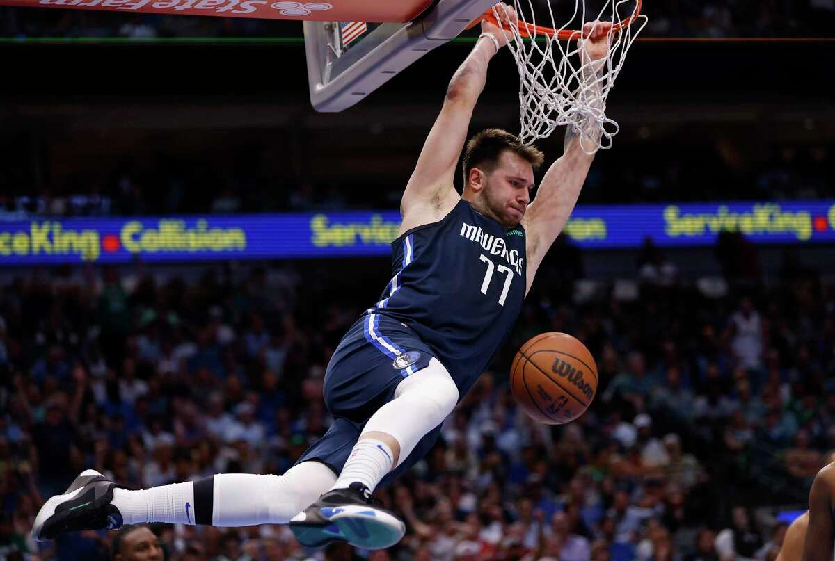 DALLAS, TEXAS - MAY 12: Luka Doncic #77 of the Dallas Mavericks dunks the ball against the Phoenix Suns in the third quarter of Game Six of the 2022 NBA Playoffs Western Conference Semifinals at American Airlines Center on May 12, 2022 in Dallas, Texas. NOTE TO USER: User expressly acknowledges and agrees that, by downloading and/or using this photograph, User is consenting to the terms and conditions of the Getty Images License Agreement. (Photo by Ron Jenkins/Getty Images) *** BESTPIX ***