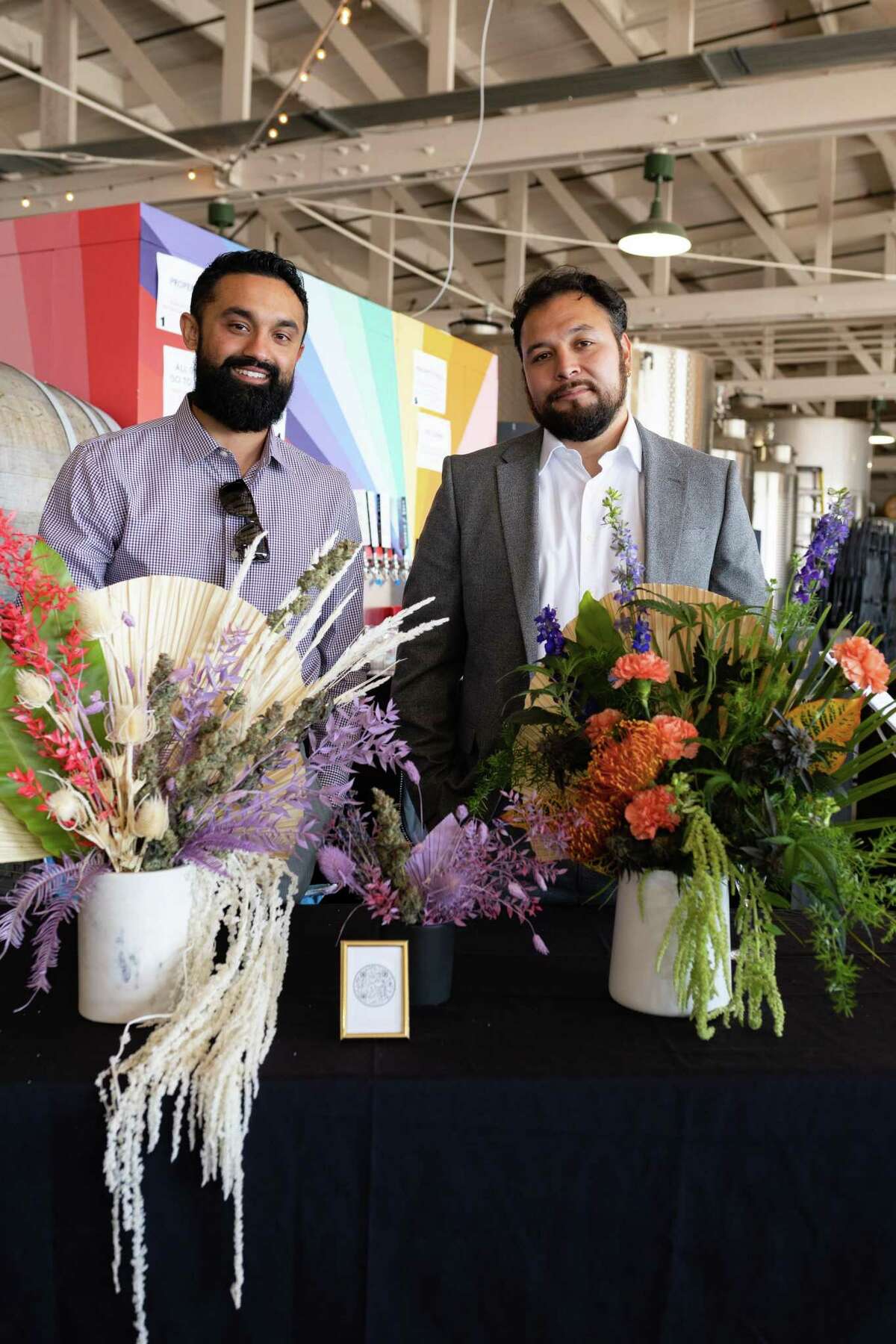 Ashhok Umashankar (left) and Noah Brozosky, owners of Bouquet Blendz, a full service cannabis catering and delivery service, use fresh and dried cannabis in their centerpieces and bouquets.