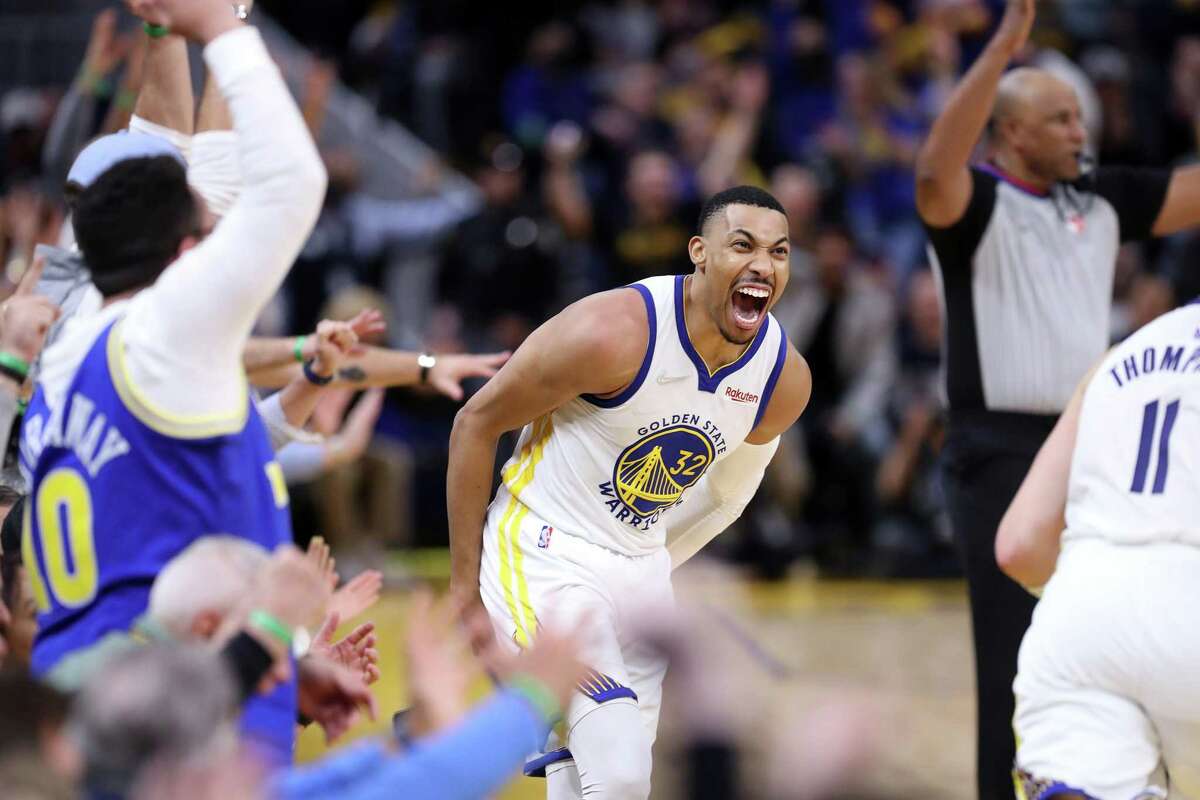 Golden State Warriors’ Otto Porter, Jr. reacts to a Klay Thompson basket in 3rd quarter of Warriors’ 126-106 win over Denver Nuggets in Game 2 of NBA Western Conference 1st round playoff series at Chase Center in San Francisco, Calif, on Monday, April 18, 2022.