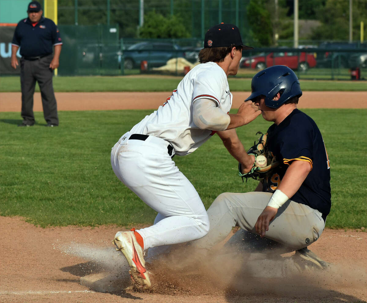 Edwardsville's Kayden Jennings applies a tag at third against O'Fallon on Tuesday at Tom Pile Field in Edwardsville.