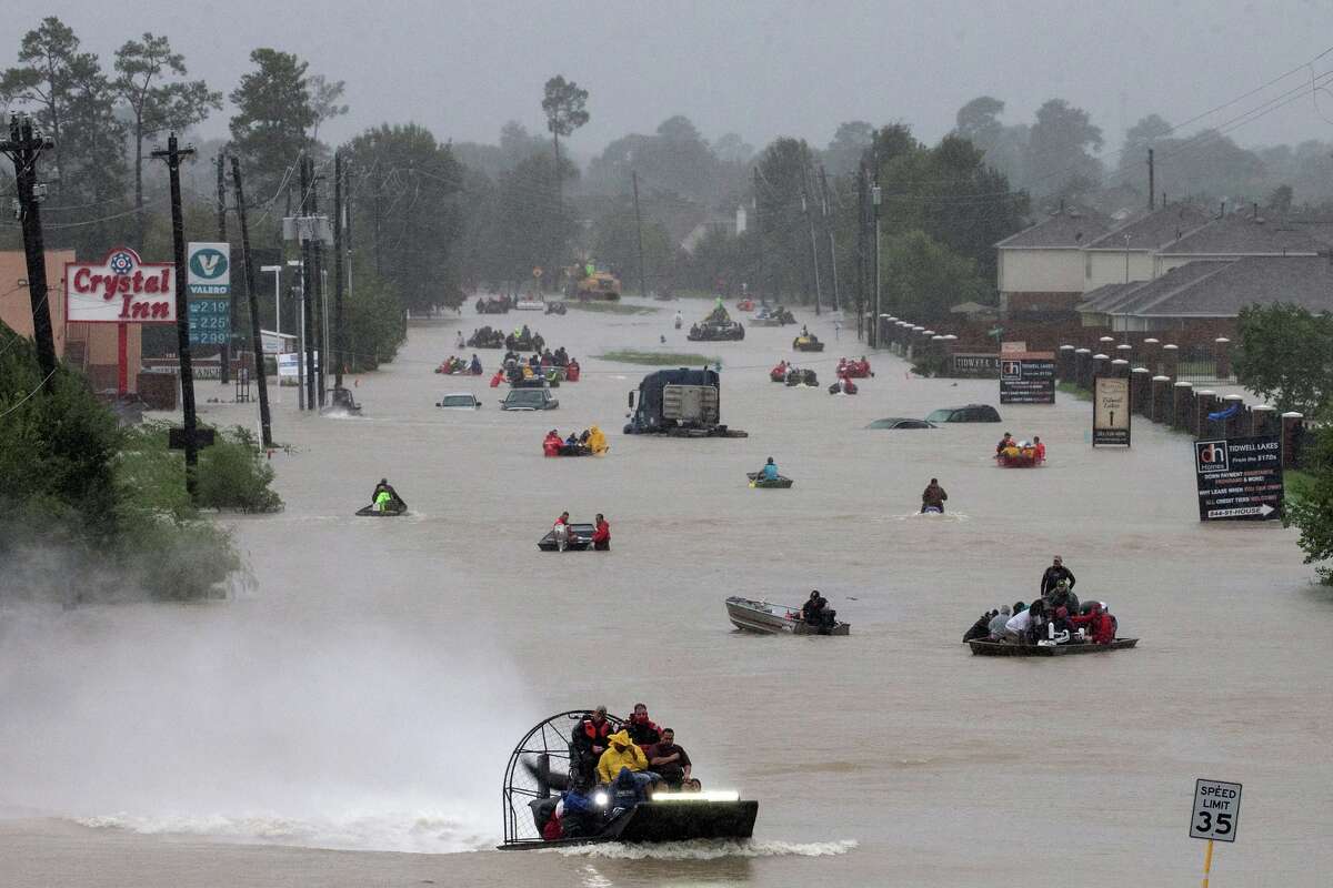 Houston residents used boats to evacuate floodwaters from Harvey in 2017. 