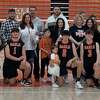 Shelton boys' volleyball coach LeAnne Bianchine and family members celebrate the contribution of senior members of the team.