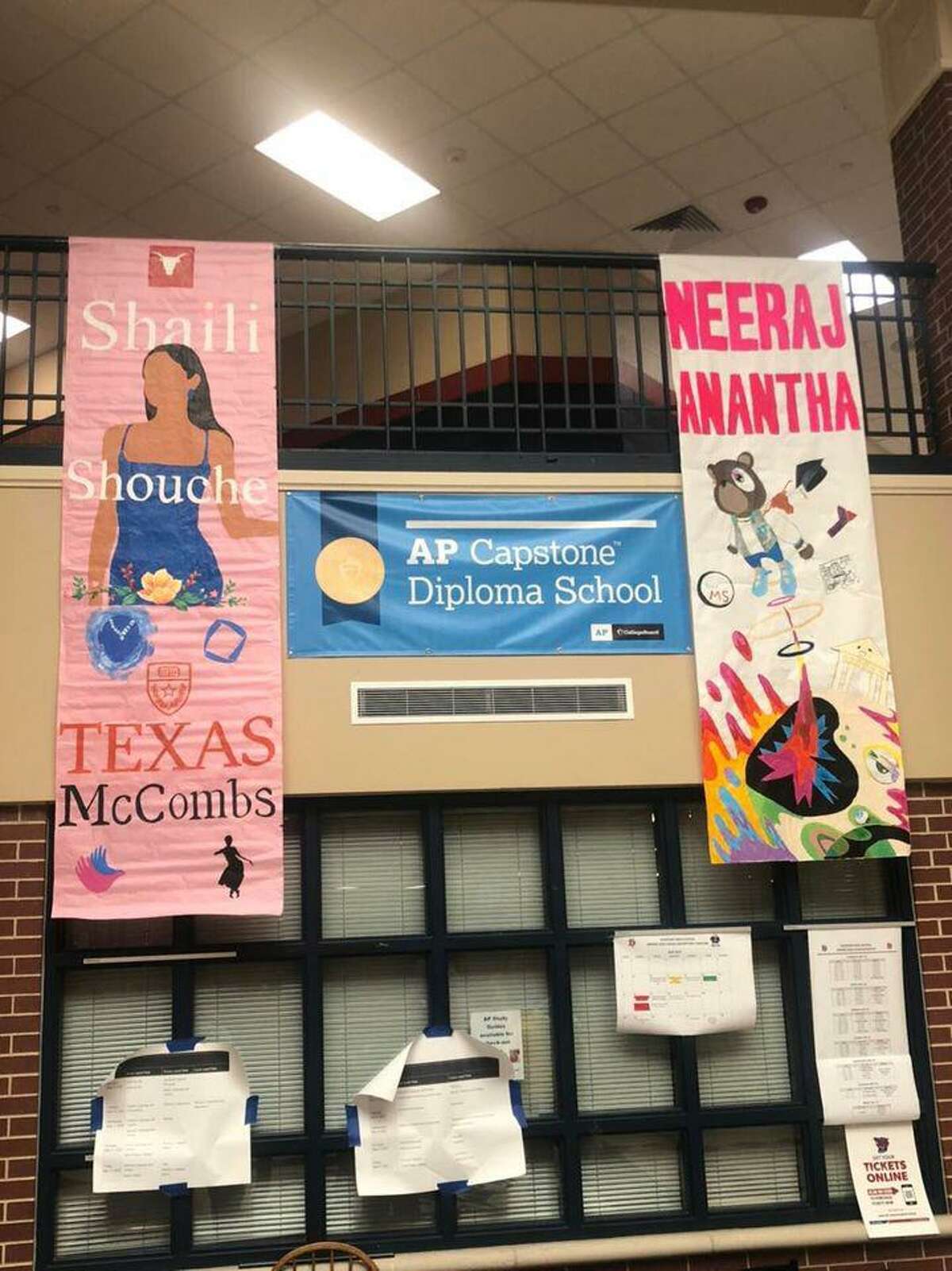 Banners decorating the entrance hallway at Dawson High School were created by members of the school's student council to honor each of the Top 20-ranked graduating seniors.