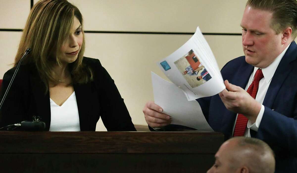 Jason Goss, right, an attorney with the LaHood Norton Law Group, questions Assistant DA Melissa Saenz in 2019 during a hearing to disqualify LaHood's firm from defending a family violence suspect.