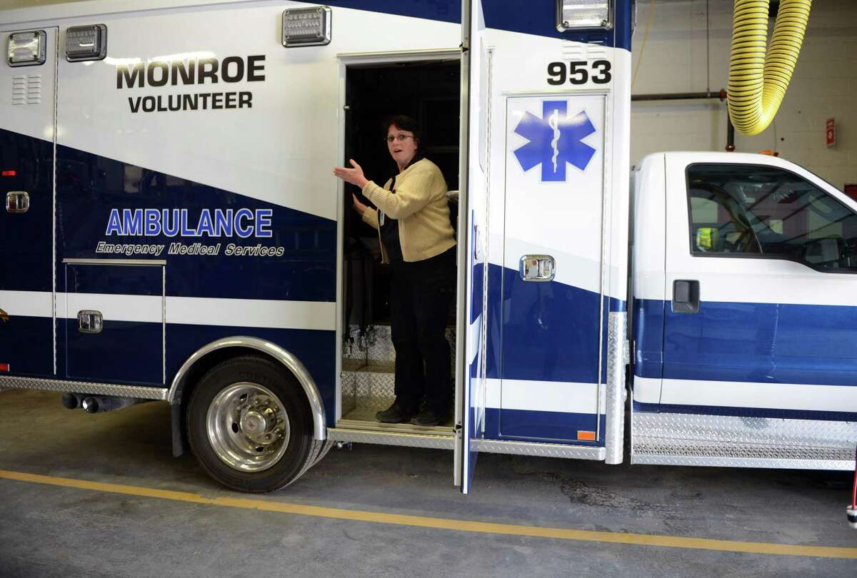 Emergency Medical Technician Gail Sawicki shows off one of Monroe’s new ambulances Thursday, Jan. 22, 2015 at the Monroe Volunteer Fire Department’s Jockey Hollow Fire Station.