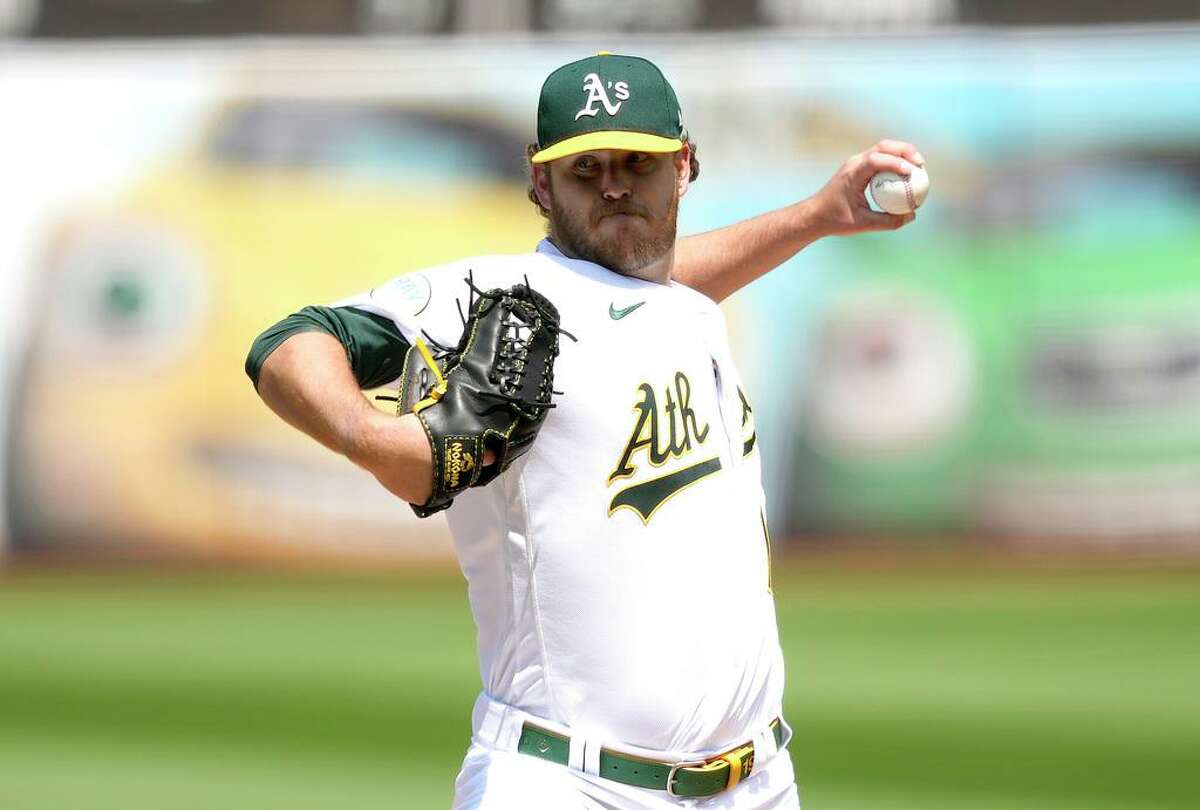 OAKLAND, CALIFORNIA - APRIL 24: Cole Irvin #19 of the Oakland Athletics pitches against the Texas Rangers in the top of the first inning at RingCentral Coliseum on April 24, 2022 in Oakland, California. (Photo by Thearon W. Henderson/Getty Images)
