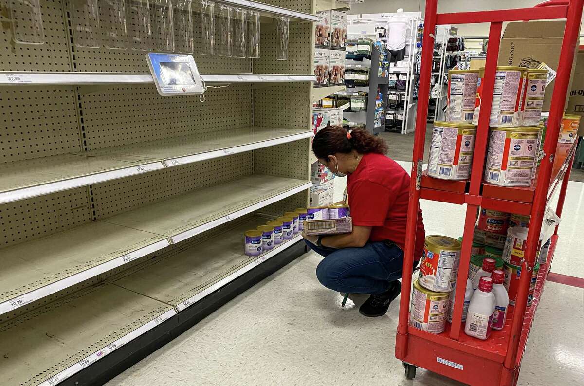 A worker restocks shelves with baby formula at a store in Pinole, California, US, on Tuesday, May 17, 2022. President Joe Biden said he expects increased imports of baby formula to relieve a U.S. shortage “in a matter of weeks or less,” as pressure mounts from parents and lawmakers to address the problem.