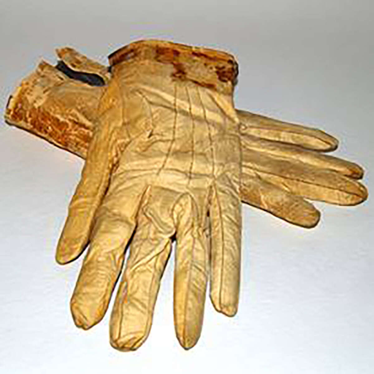 Items related to Abraham Lincoln, including the gloves he was carrying the night he was shot, will be on display through October at the Abraham Lincoln Presidential Library and Museum. 