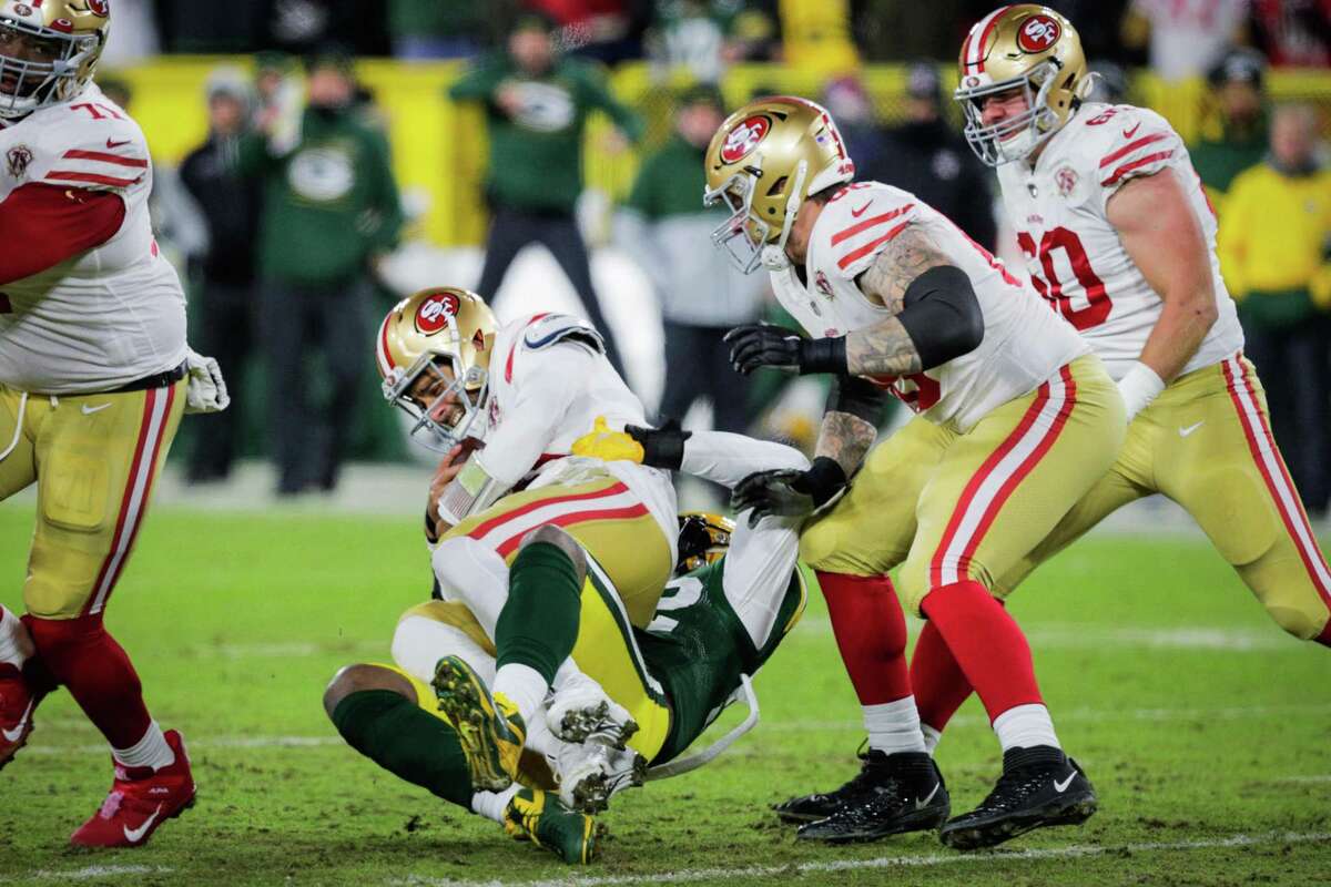Green Bay Packers nose tackle Kenny Clark sacks San Francisco 49ers quarterback Jimmy Garoppolo in a January playoff game. The Supreme Court approved Gov. Gavin Newsom’s request to grant clemency to Clark’s father, Kenny Clark Sr., who was convicted of murder in 2005.