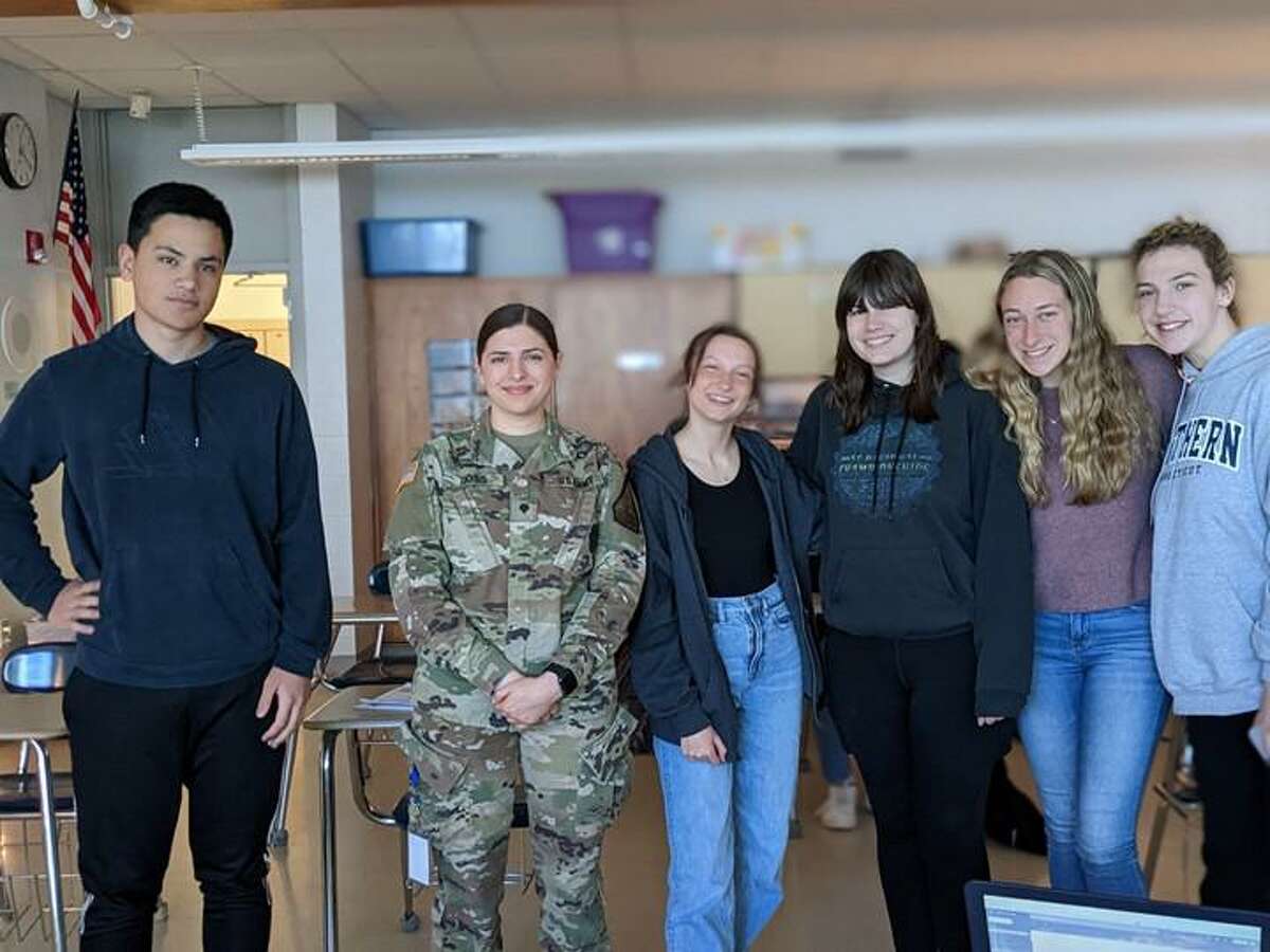 From left, Owen Ryan, Allison Gollenberg, Searlait Curtiss, Ashlyn Tranquillo, and Sara Castonguay meet with U.S. Army National Guard Sergeant Claire Ross to plan the Relay for Life event.