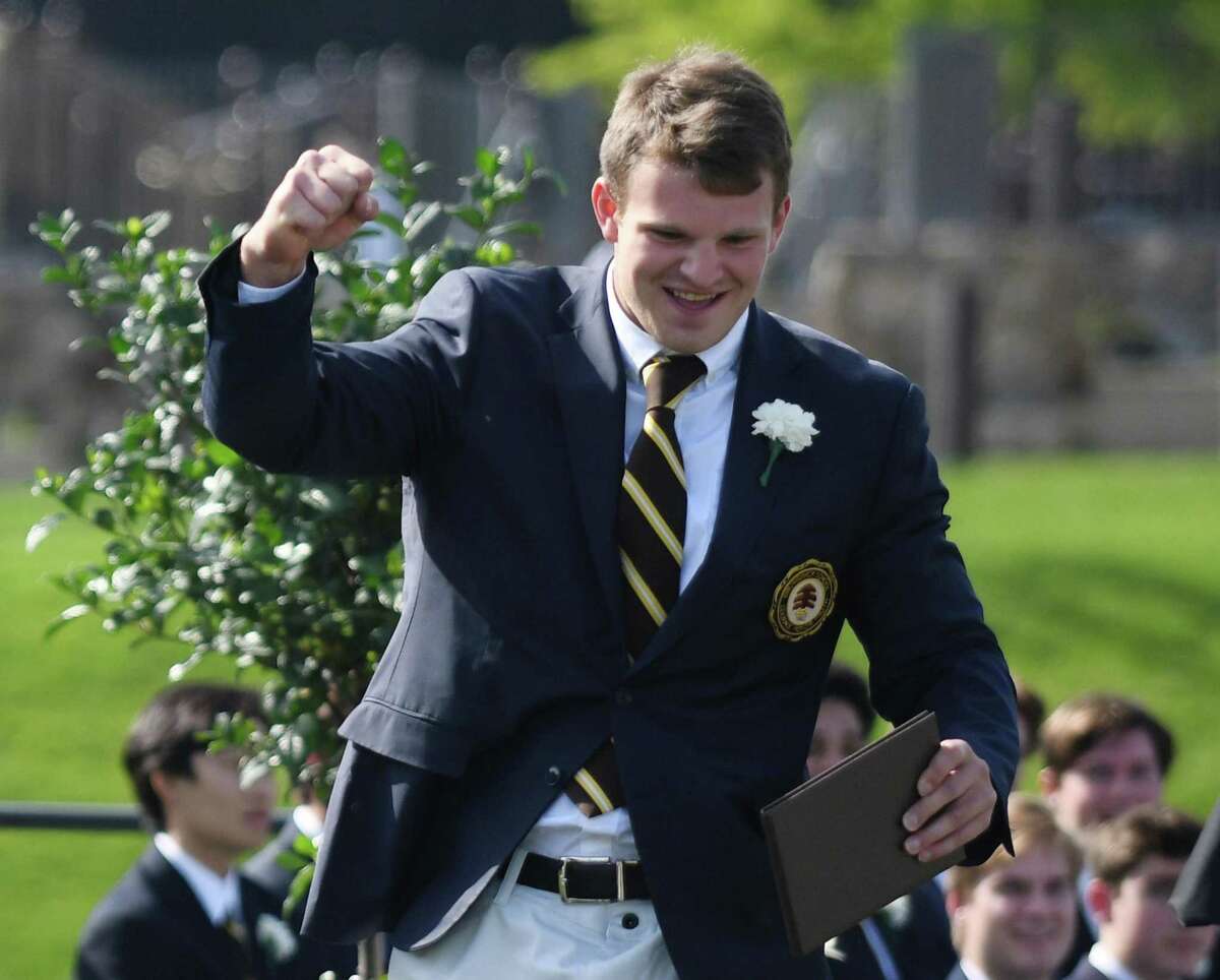 Hunter Clark celebrates after receving his diploma at the Brunswick School 120th Commencement at Brunwick's Lower School Campus in Greenwich, Conn. Wednesday, May 18, 2022.