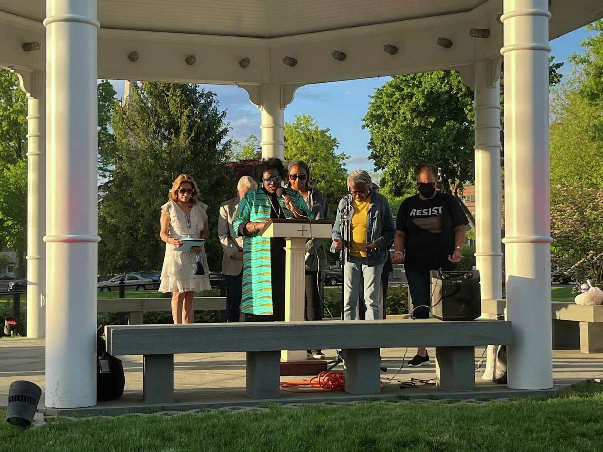 The Rev. Tamara Moreland shares a prayer at the Norwalk vigil on May 18, 2022, to remember victims of the Buffalo supermarket shooting that occurred on May 14. About 75 city residents gathered on the town green to stand against acts of violence and hate.