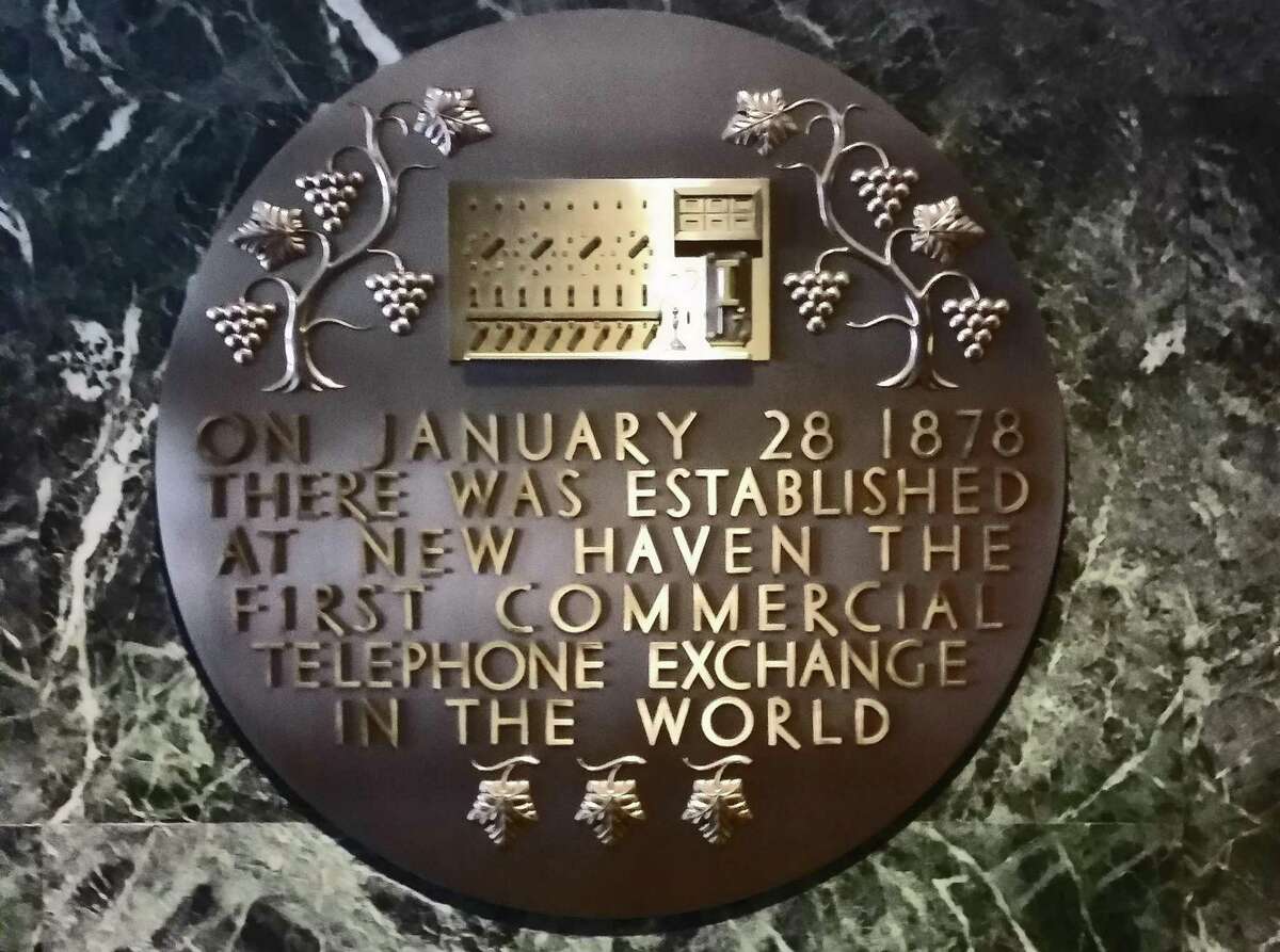 A marker in the lobby of Frontier’s main building in New Haven, Conn., commemorating the city as the site of the world’s first commercial telephone exchange in 1878.