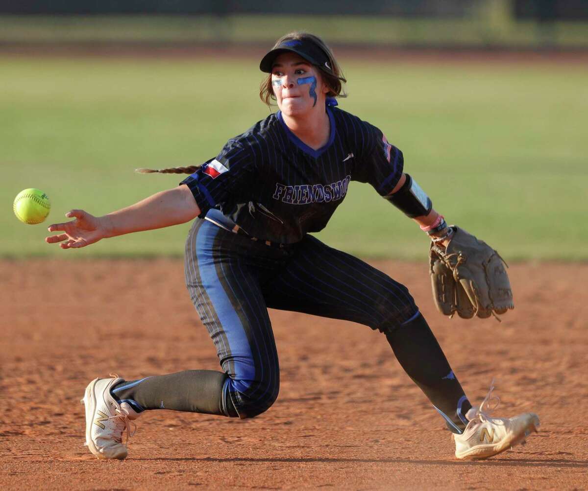 Friendswood shortstop Baileigh Burtis (8) tries to bare hand a ground ball hit by Carmen Uribe of Lake Creek in the third inning of the opening game of a best-of-three Class 5A regional semifinal softball series at Katy Tompkins.