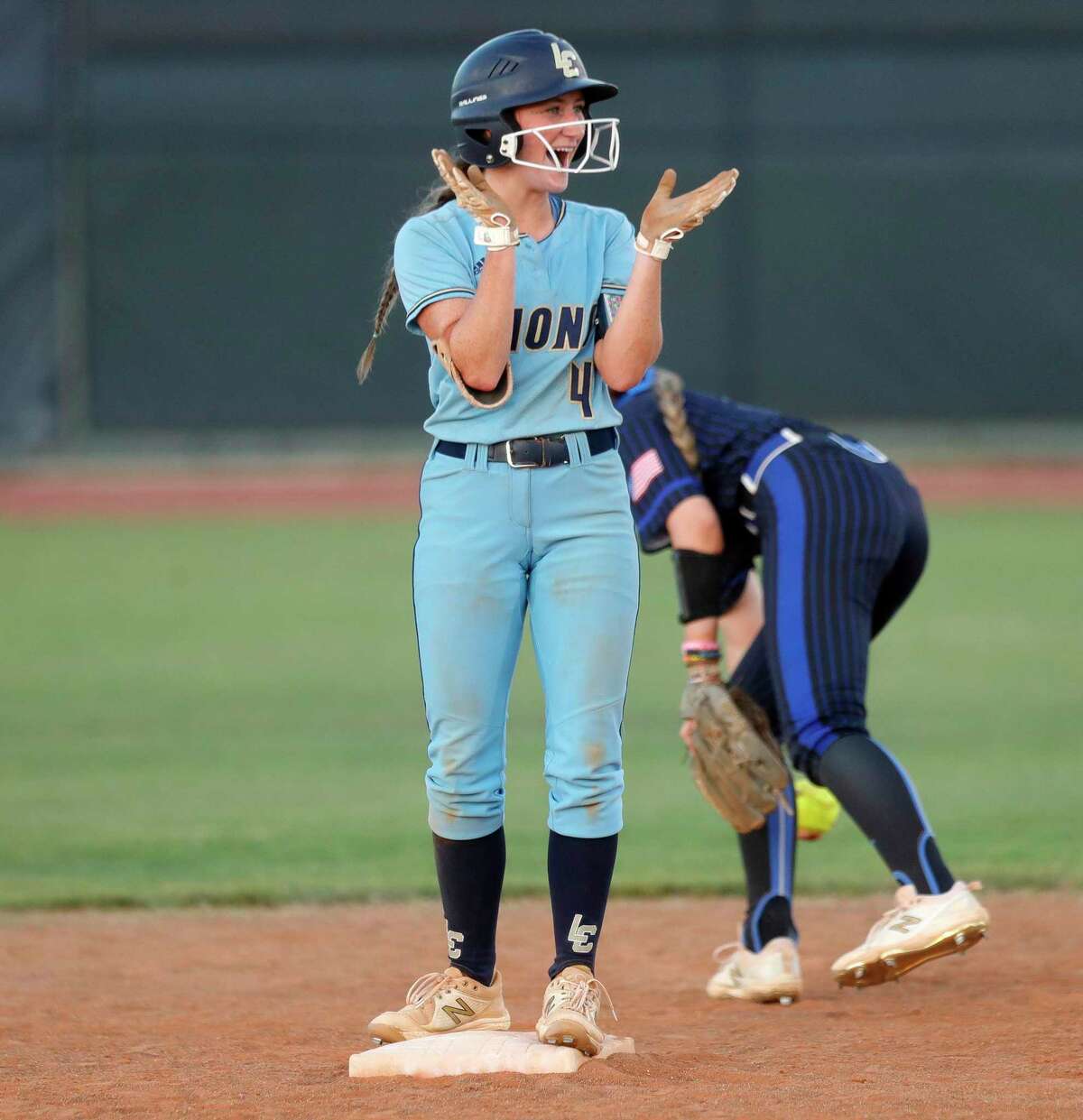 Caelee Clark #4 of Lake Creek reacts after hitting a double in the fifth inning of Game 1 of a Region III-5A semifinal high school softball series at Katy Tompkins High School, Wednesday, May 18, 2022, in Katy.