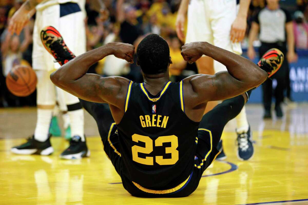 Golden State Warriors forward Draymond Green (23) reacts after scoring two as he was fouled by Dallas Mavericks forward Maxi Kleber (42) in the second quarter of Game 1 of the NBA Western Conference finals against the Dallas Mavericks at Chase Center, Wednesday, May 18, 2022, in San Francisco, Calif.