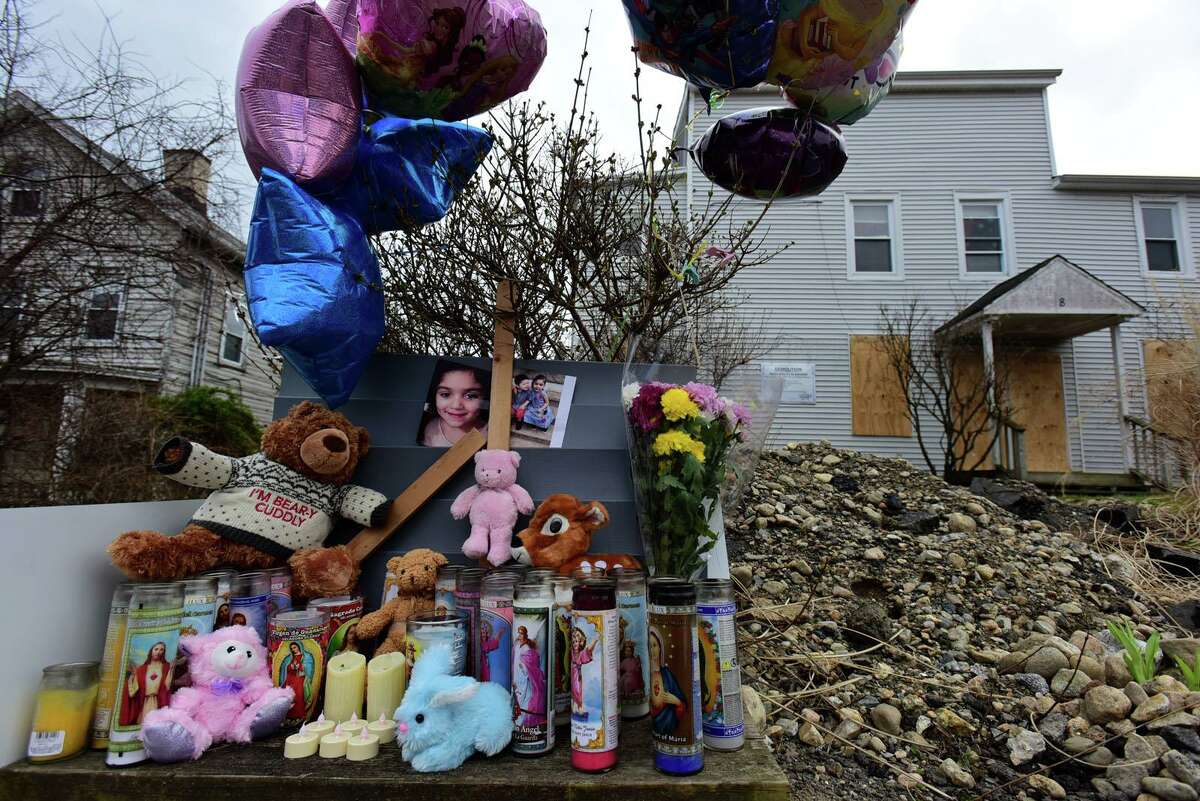 A memorial was set up in front of the dilapidated Elizabeth Street home in Norwalk days after police said 27-year-old Yimi Moncada died by suicide and killed his 5-year-old daughter Giselle and his 4-year-old son, Jesus.