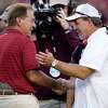 Alabama head coach Nick Saban, left, and Texas A&Mhead coach Jimbo Fisher, right, shake hands during pre-game of an NCAA college football game on Saturday, Oct. 9, 2021, in College Station, Texas.
