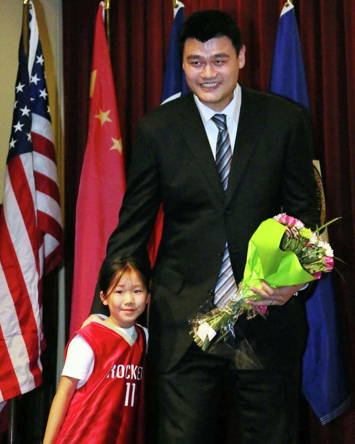 Melody Huang, daughter of Yao Ming Fan Club President Peter Huang, pictured with Yao Ming at the Yao Ming Day Celebration at City Hall on Feb. 15, 2013.
