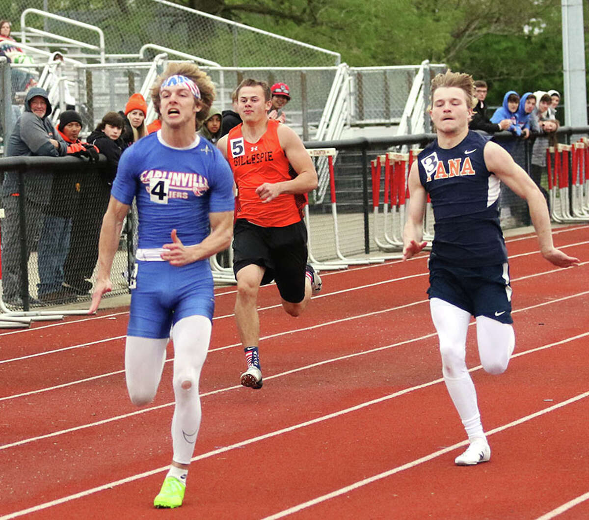 Carlinville senior Ethen Siglock (left) runs to victory in the 100 meters at the SCC Meet on May 3 in Staunton. On Wednesday in Virden, Siglock qualified for state in four events at the North Mac Class 1A Sectional.