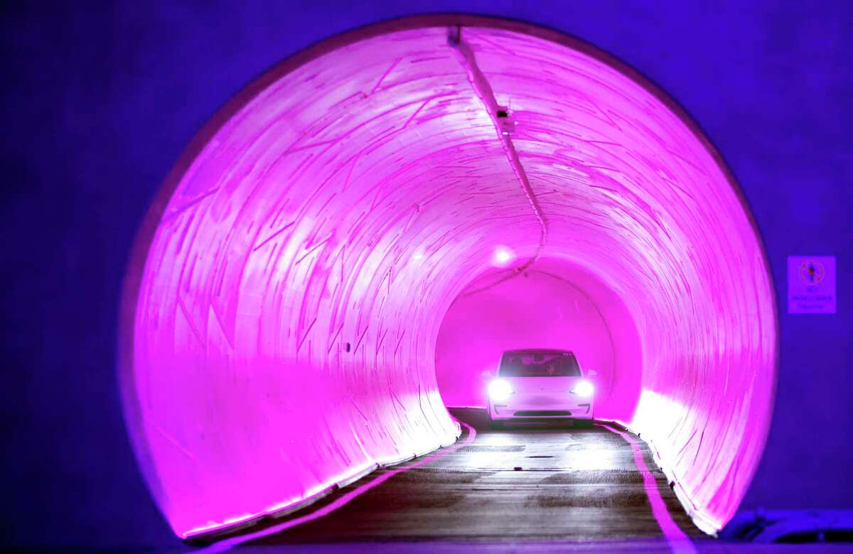 A Tesla electric vehicle heads through a tunnel during a 2021 tour of the Las Vegas Convention Center Loop, Elon Musk’s underground transportation system. The Las Vegas Convention Center Loop is the first commercial endeavor for Musk’s Boring Co., which has proposed an airport-to-downtown loop in San Antonio.