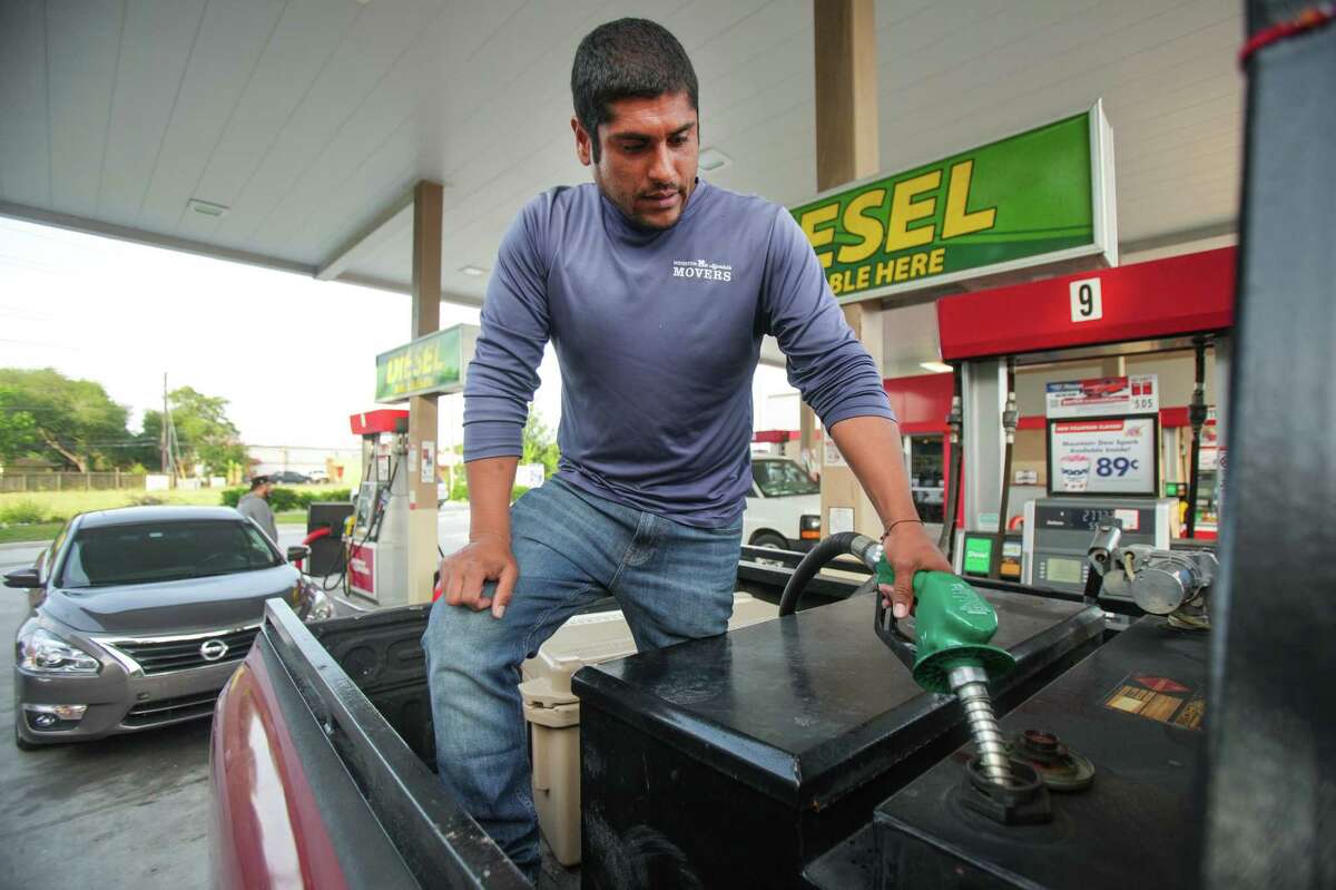 Diego Davalos, owner of Houston Affordable Movers, fills his reserve tank with diesel Monday, May 16, 2022 in Houston. Diesel prices are at record-breaking highs, forcing truckers, farmers and fishermen to raise prices and scale back their operations to recoup costs. Some, like Davalos, have lost business as they raise prices to cover soaring transportation costs.