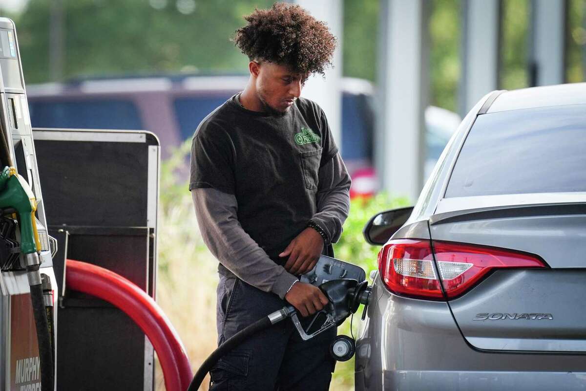 Nahom Teka pumps gas into his vehicle Monday, May 16, 2022 in Houston. Average Houston gas prices leap above $4 a gallon for first time, setting record high.