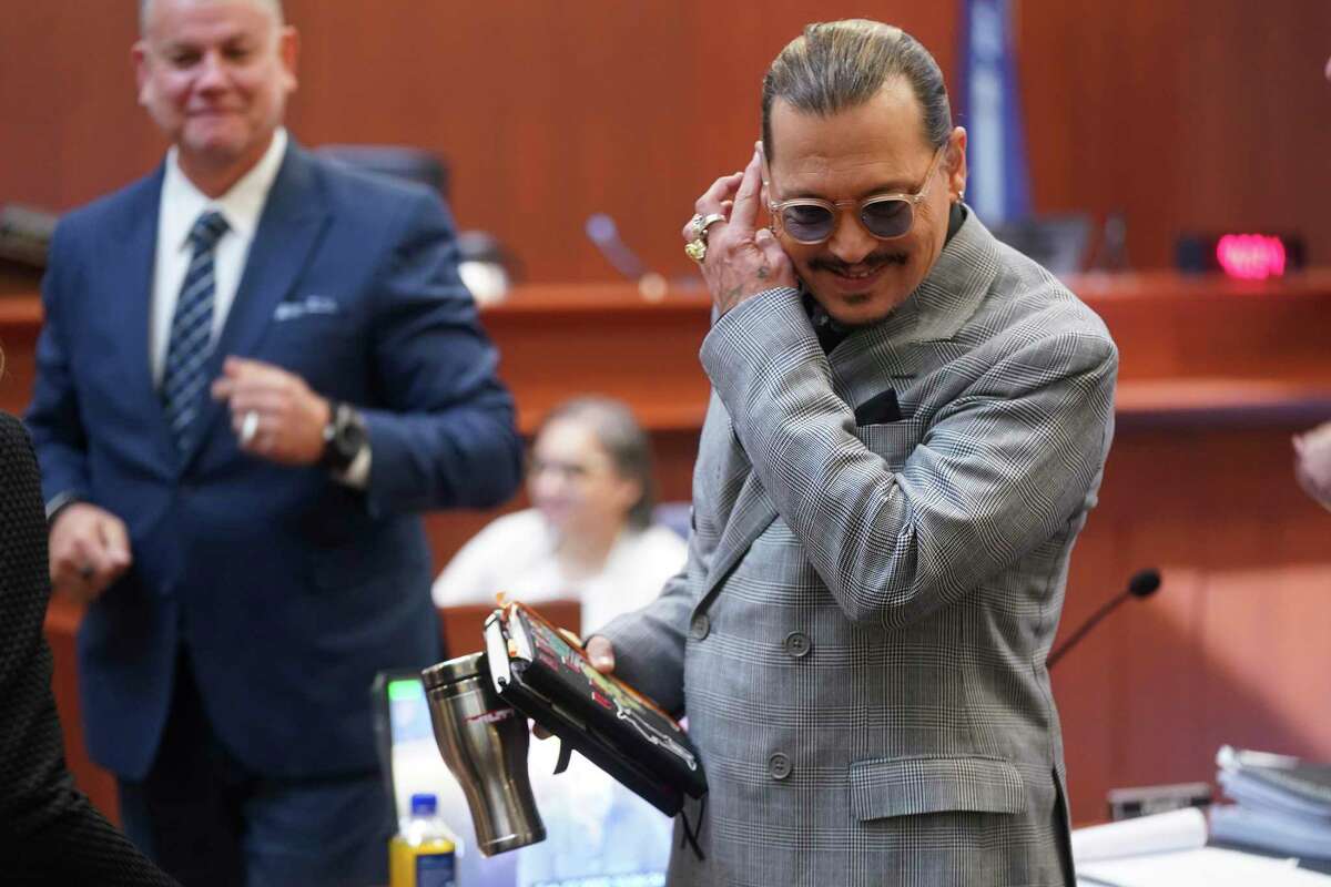 Actor Johnny Depp arrives in the courtroom at the Fairfax County Circuit Courthouse in Fairfax, Va., Thursday, May 19, 2022. Actor Johnny Depp sued his ex-wife Amber Heard for libel in Fairfax County Circuit Court after she wrote an op-ed piece in The Washington Post in 2018 referring to herself as a "public figure representing domestic abuse." (Shawn Thew/Pool photo via AP)