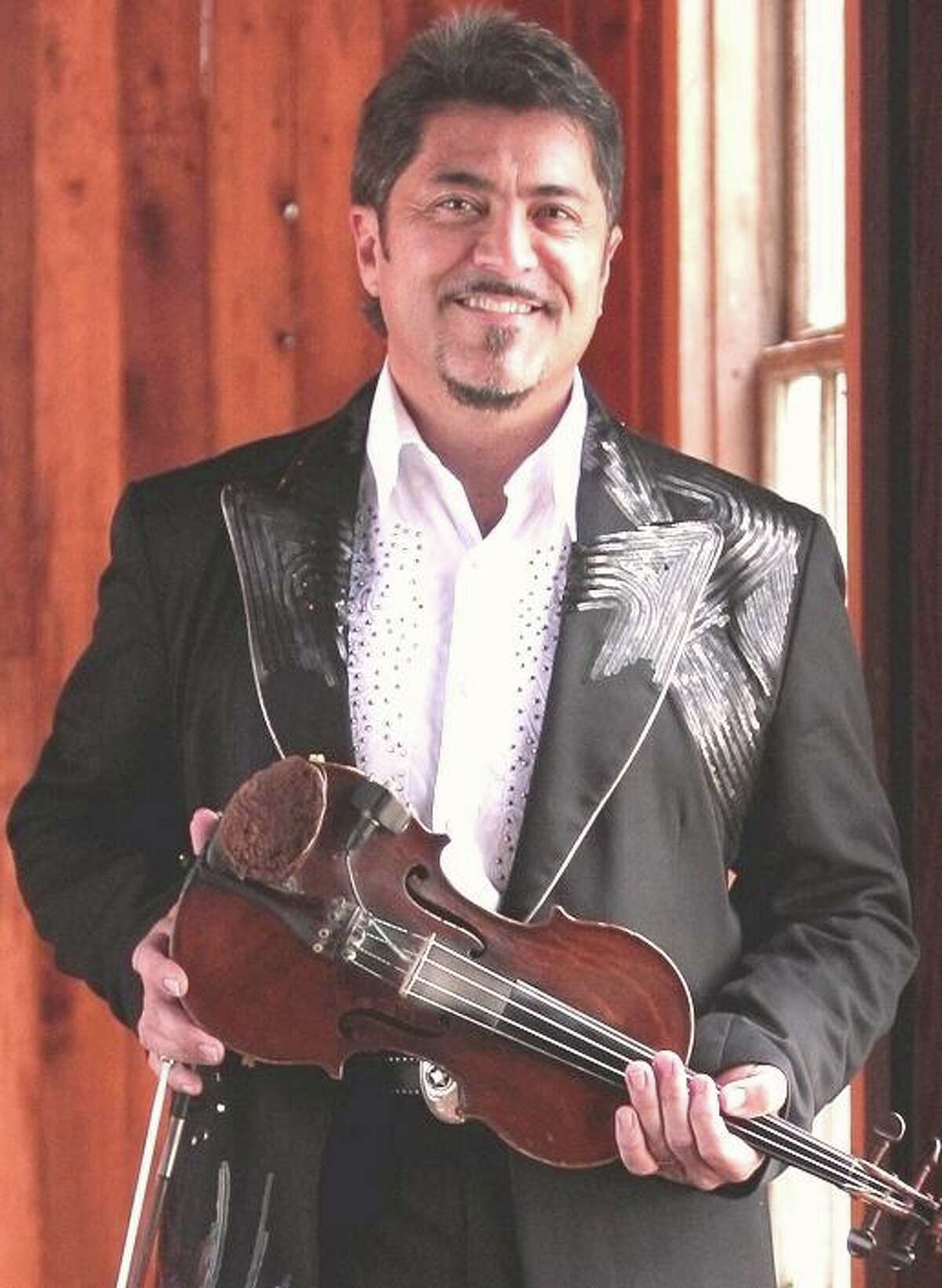 Conroe concert promoters Gene and Betty Wolf are helping longtime musician Bobby Flores in his fight against Stage IV Esophageal Cancer. They have secured a guitar signed by George Strait and a violin signed by Ray Price to auction off for Flores benefit.
