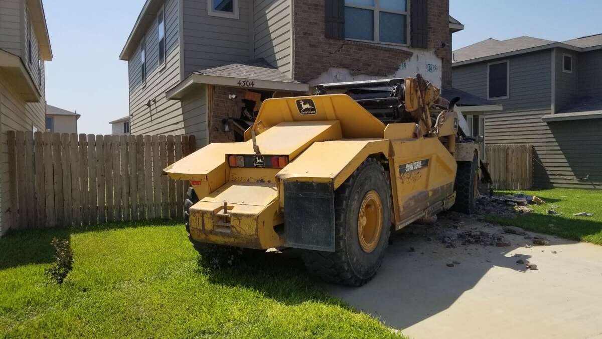 First responders said that bulldozer crashed into a home in south Laredo on Wednesday.
