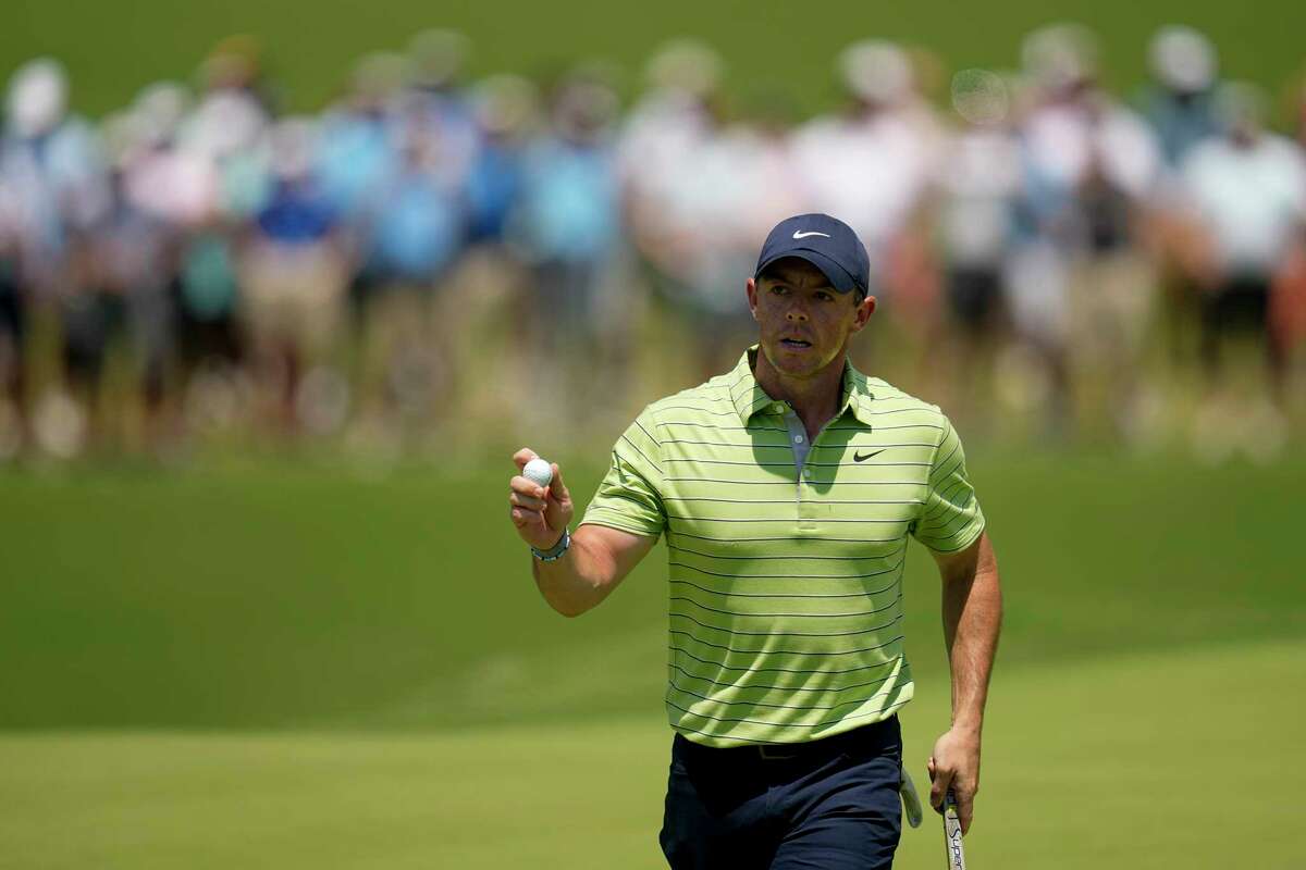 Rory McIlroy, of North Ireland, waves after making a putt on the first hole during the first round of the PGA Championship golf tournament, Thursday, May 19, 2022, in Tulsa, Okla.