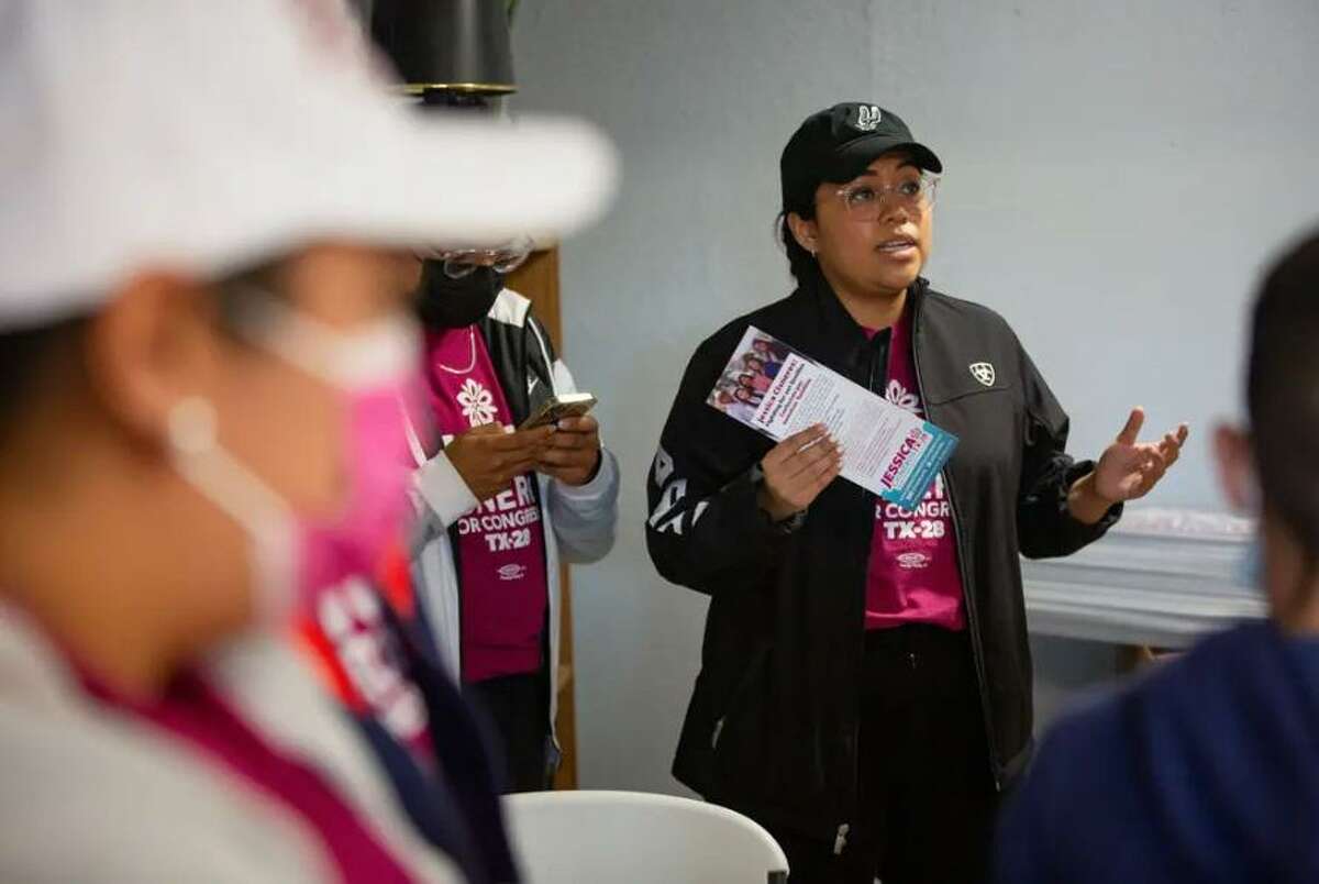 Jessica Cisneros talks with her supporters before heading out to canvass at her campaign headquarters in Laredo on Feb. 19, 2022.