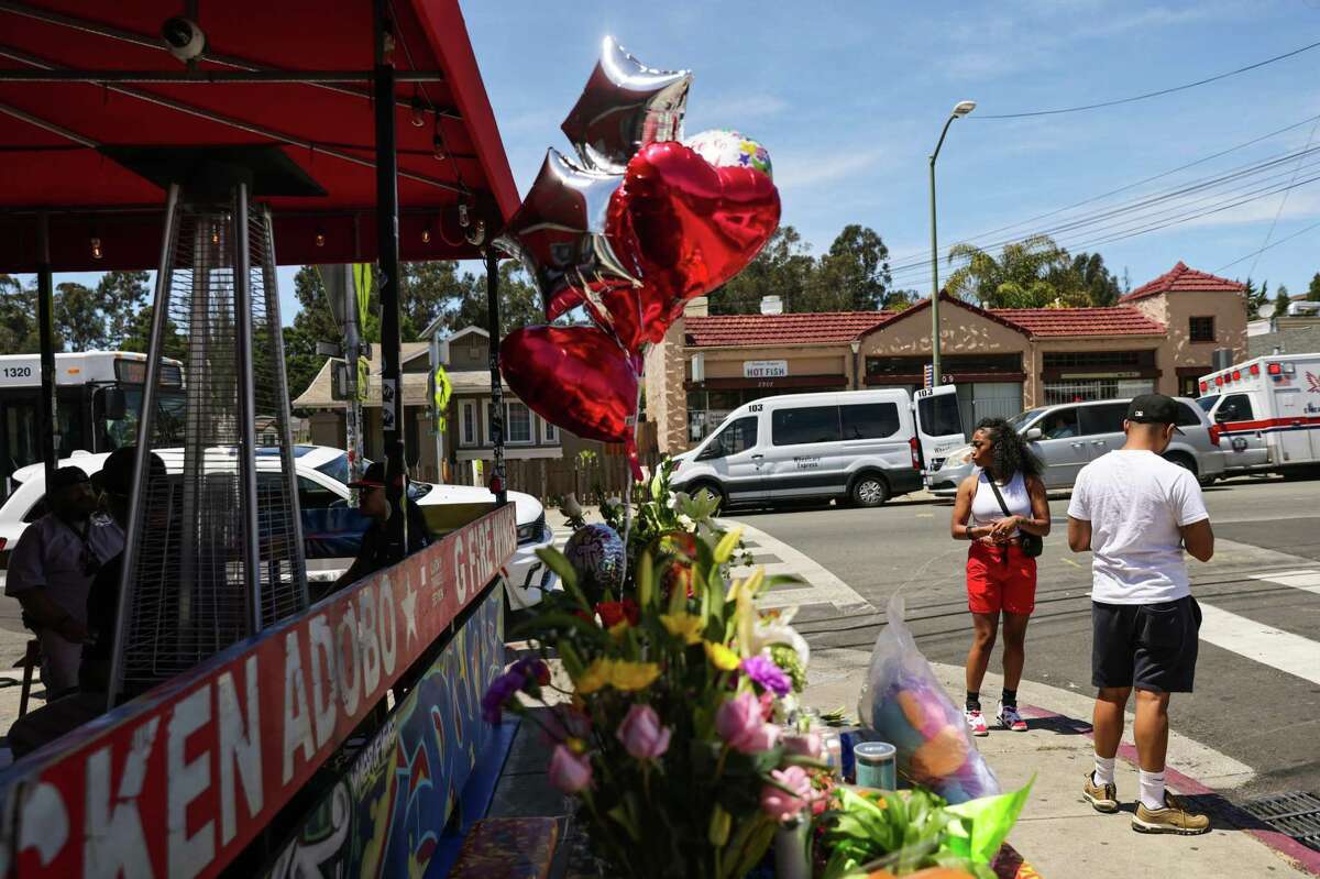 A memorial outside of Lucky Three Seven in Oakland memorializes the restaurant’s slain co-owner.