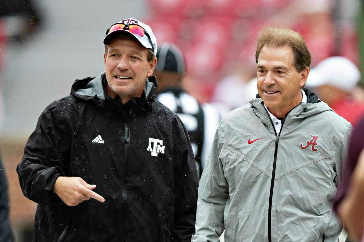 Texas A&M coach Jimbo Fisher, left, and Alabama coach Nick Saban got into a war of words after Saban accused Fisher and the Aggies for “buying every player” on the team. Fisher, a former assistant under Saban at LSU, then implored reporters to dig into Saban’s past practices, calling them “despicable.”
