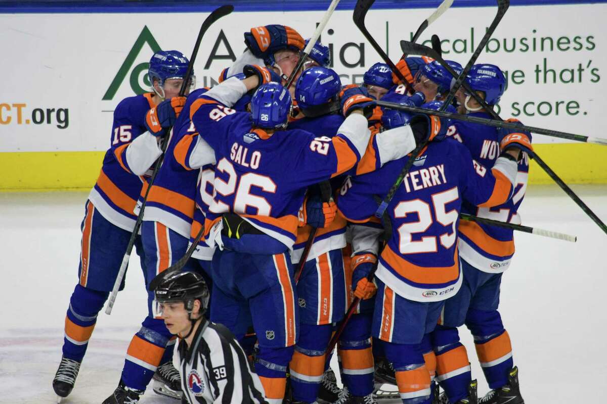 The Bridgeport Islanders celebrate an overtime goal by Aautu Raty (16) against the Providence Bruins in Game 2 of their AHL playoff series on May 4, 2022 at Total Mortgage Arena in Bridgeport, Conn. The Islanders beat the Bruins 2-1 to win the series 2-0.