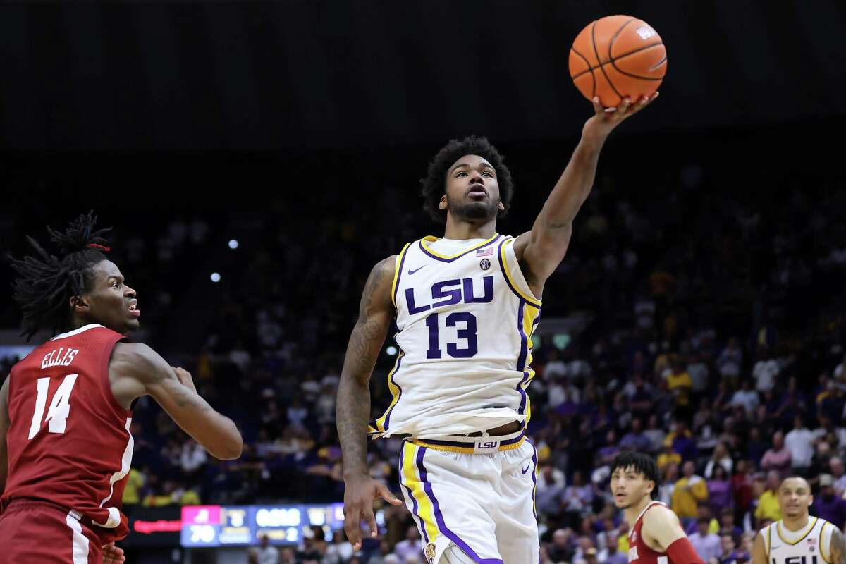 BATON ROUGE, LOUISIANA - MARCH 05: Tari Eason #13 of the LSU Tigers shoots as Keon Ellis #14 of the Alabama Crimson Tide defends during a game at the Pete Maravich Assembly Center on March 05, 2022 in Baton Rouge, Louisiana. (Photo by Jonathan Bachman/Getty Images)