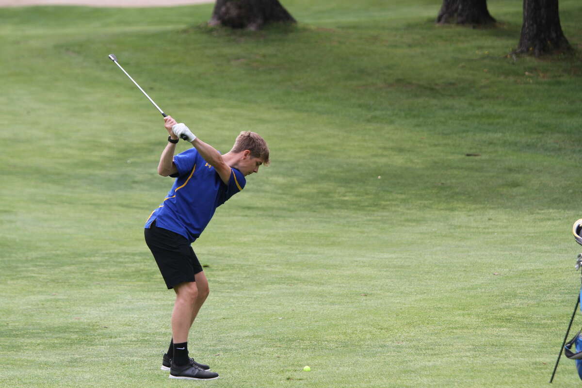 Sawyer Christiensen hits it on the green during a conference match on Thursday. 