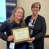 Christine Rae, Greenwich Hospital’s ‘Nurse of the Year,’ receives the Helen Meehan Award for Excellence in Nursing from Diane Kelly, the hospital’s president, during a ceremony last week.