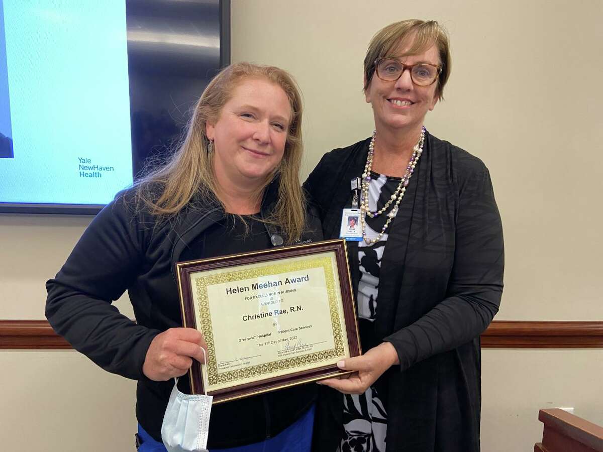Christine Rae, Greenwich Hospital’s ‘Nurse of the Year,’ receives the Helen Meehan Award for Excellence in Nursing from Diane Kelly, the hospital’s president, during a ceremony last week.