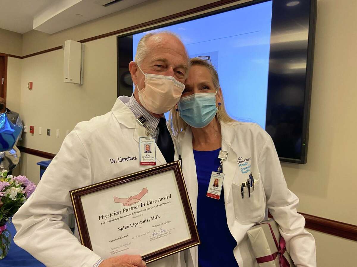 Dr. Spike Lipschutz, whose career spans more than five decades, receives the Physician Partner in Care Award from Dr. Karen Santucci, Greenwich Hospital’s chief medical officer, at a ceremony last week at the hospital.