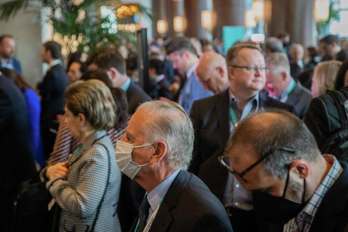 Attendees at CERAWeek by S&P Global at the Hilton Americas in downtown Houston on Wednesday, March 9, 2022. Conferences and business travel are helping demand return for downtown hotels.