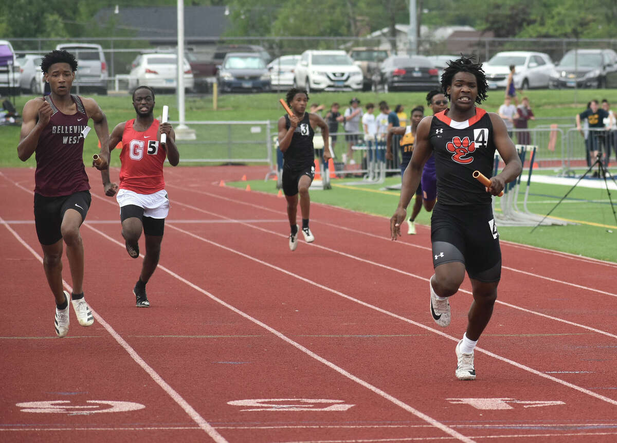 Edwardsville's Jordan Bush competes in the 800-meter relay during the Class 3A O'Fallon Sectional on Thursday in O'Fallon.