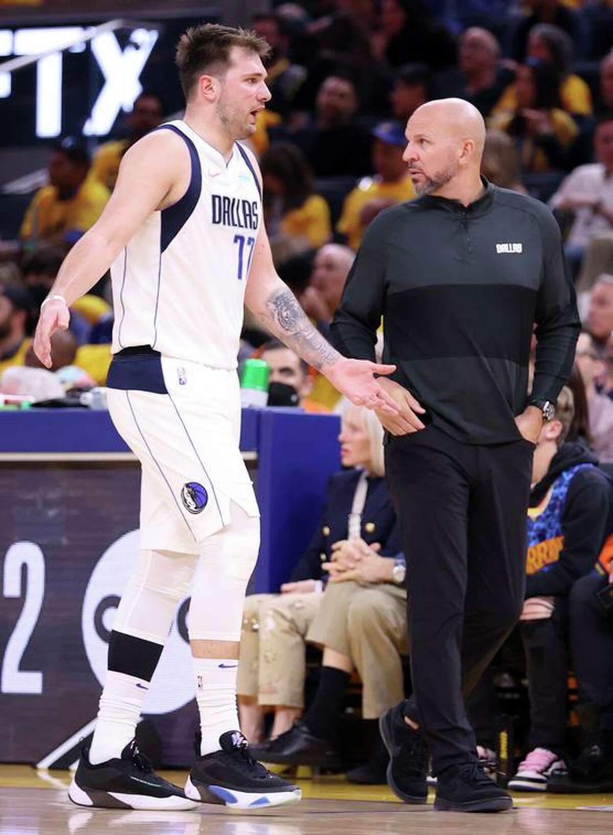 Dallas Mavericks guard Luka Doncic complains as he walks past head coach Jason Kidd during Game 1 of the Western Conference finals on Wednesday night.