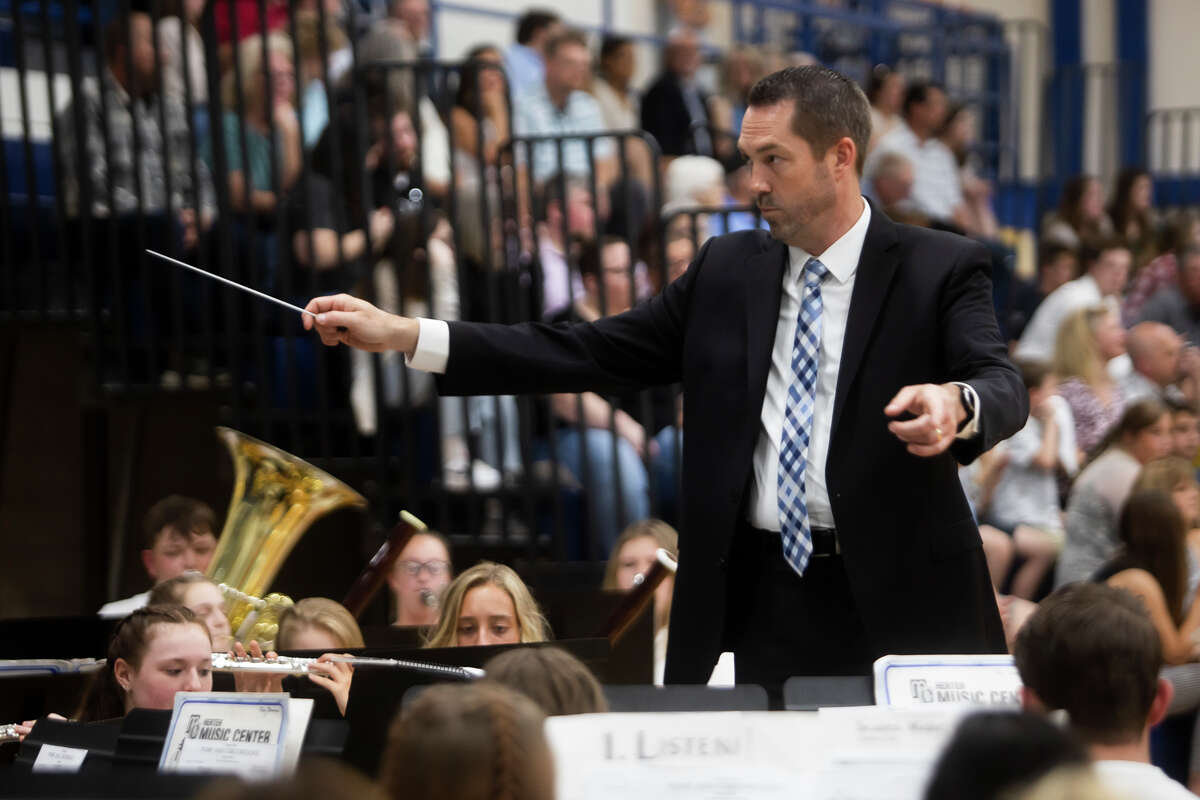 Matthew W. Shephard directs the Meridian Early College High School Symphonic Band as the Meridian Early College High School Class of 2022 celebrate their commencement Thursday, May 19, 2022 at the school in Sanford.