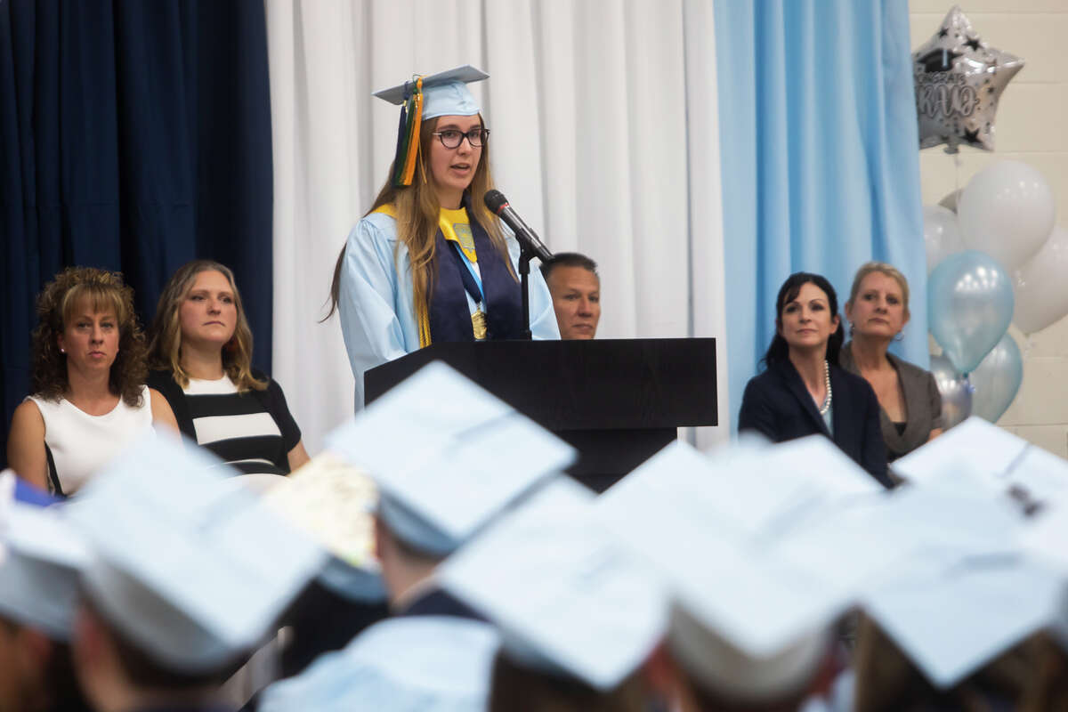 Kayla M. Funk addresses her classmates as the Meridian Early College High School Class of 2022 celebrate their commencement Thursday, May 19, 2022 at the school in Sanford.