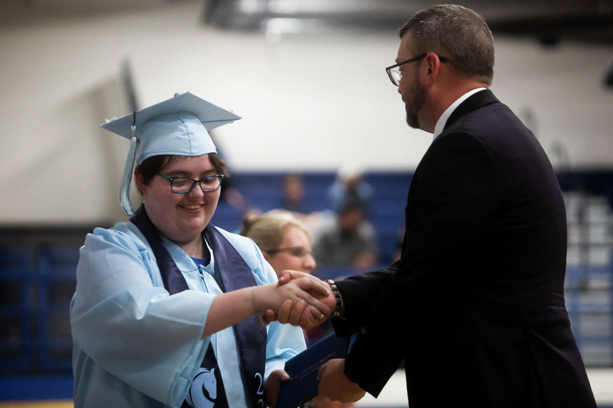 Bethann Billings receives her diploma as the Meridian Early College High School Class of 2022 celebrate their commencement Thursday, May 19, 2022 at the school in Sanford.